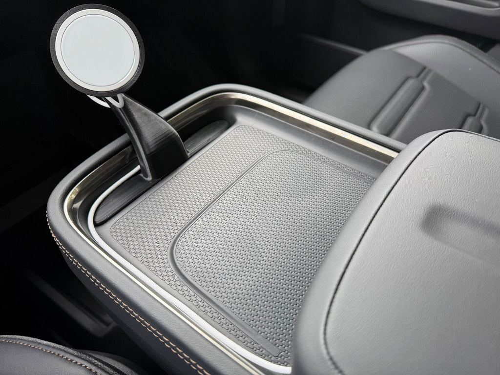 CNP Motive phone mount rising from the Rivian R2 console tray, customer photo
