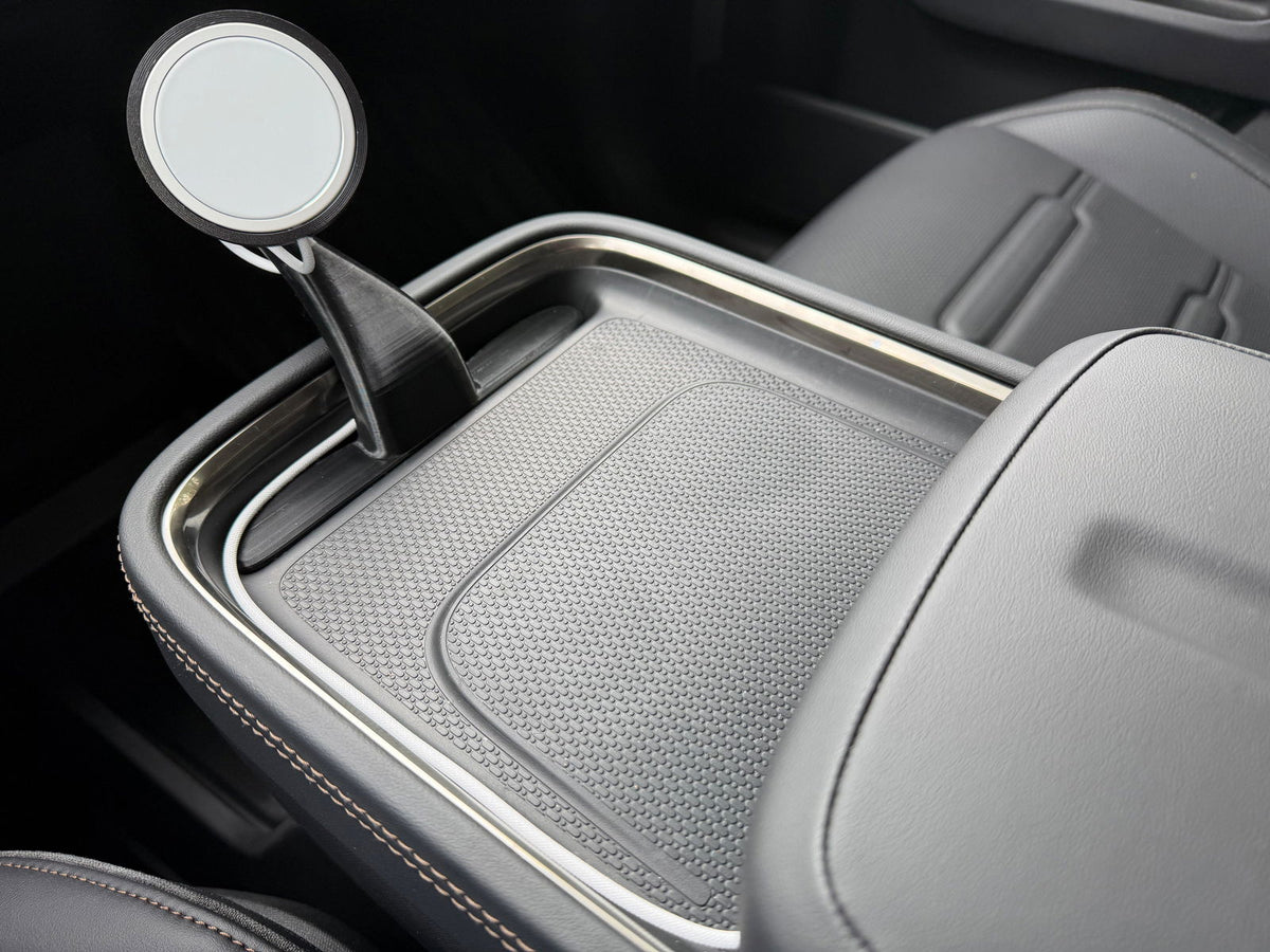 CNP Motive phone mount rising from the Rivian R2 console tray, customer photo
