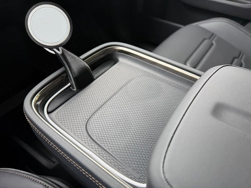 CNP Motive phone mount rising from the Rivian R2 console tray, customer photo