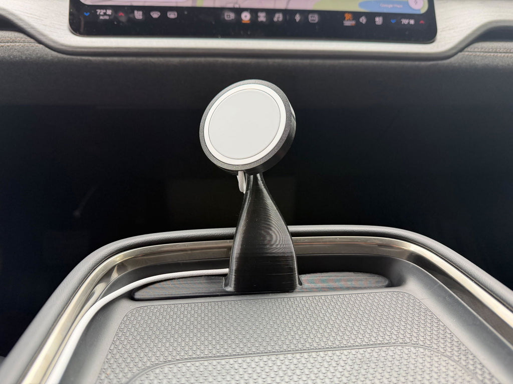 CNP Motive adjustable phone mount with Apple MagSafe charger in a Rivian R2 center console, customer photo