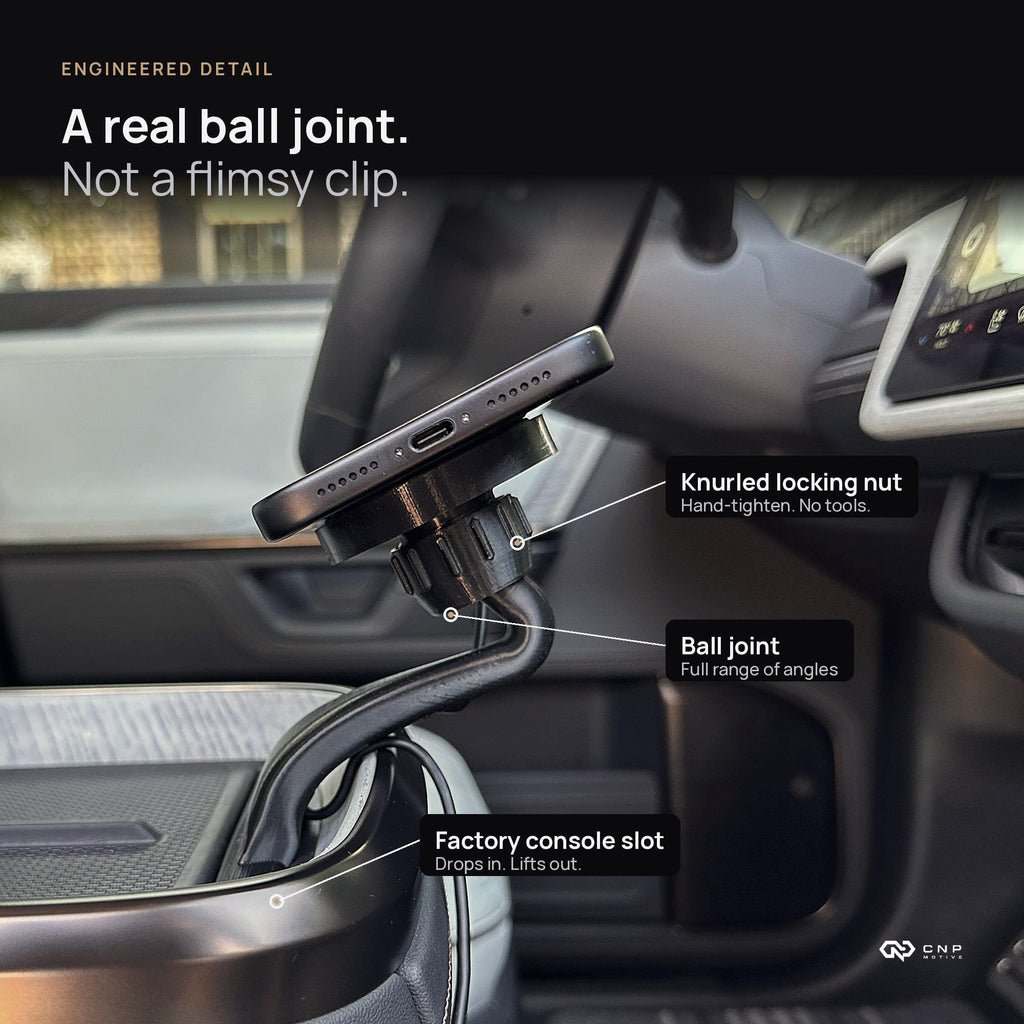 Close-up of the CNP Motive MagSafe mount ball joint, knurled locking nut, and factory console slot fit