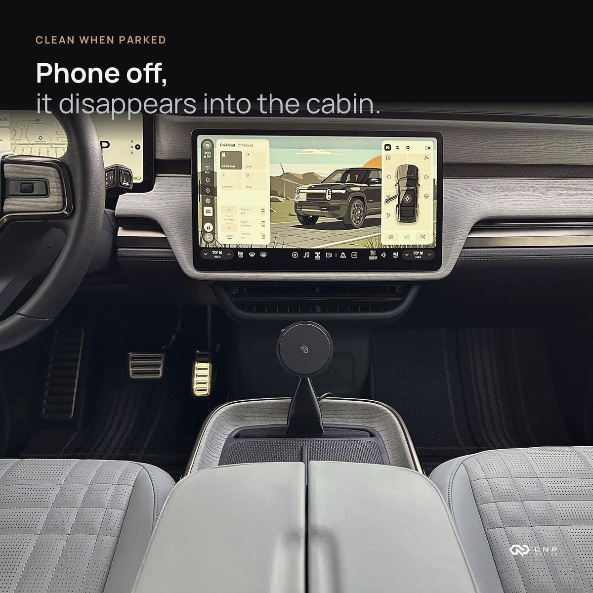 Rivian R1S interior with the MagSafe charging mount empty, sitting low in the console